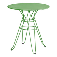 Round green table with an intricate wire design, perfect for adding a pop of color to any space.