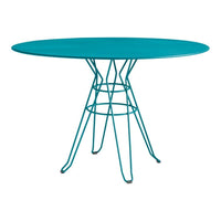 Teal oval table with a unique wire base design, perfect for modern dining spaces.