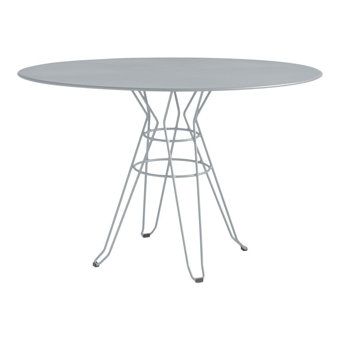 Silver oval table with a sleek metallic base showcasing a minimalist design and contemporary style.
