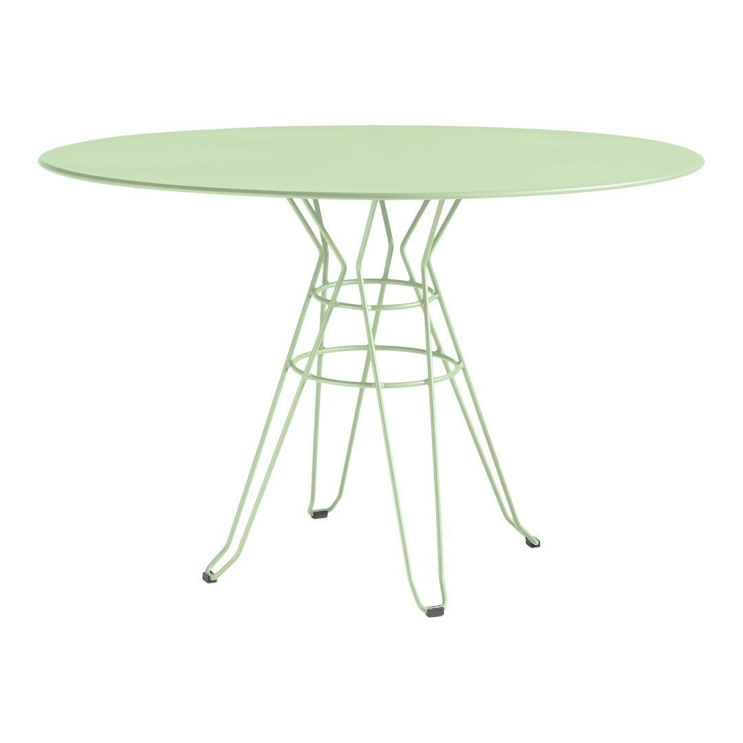 Oval green table with a sleek wireframe base, ideal for modern outdoor or indoor settings.