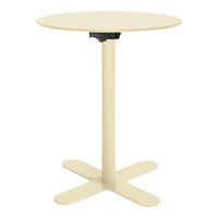 Round cream-colored table with a sleek design and sturdy cross-base, perfect for modern spaces.