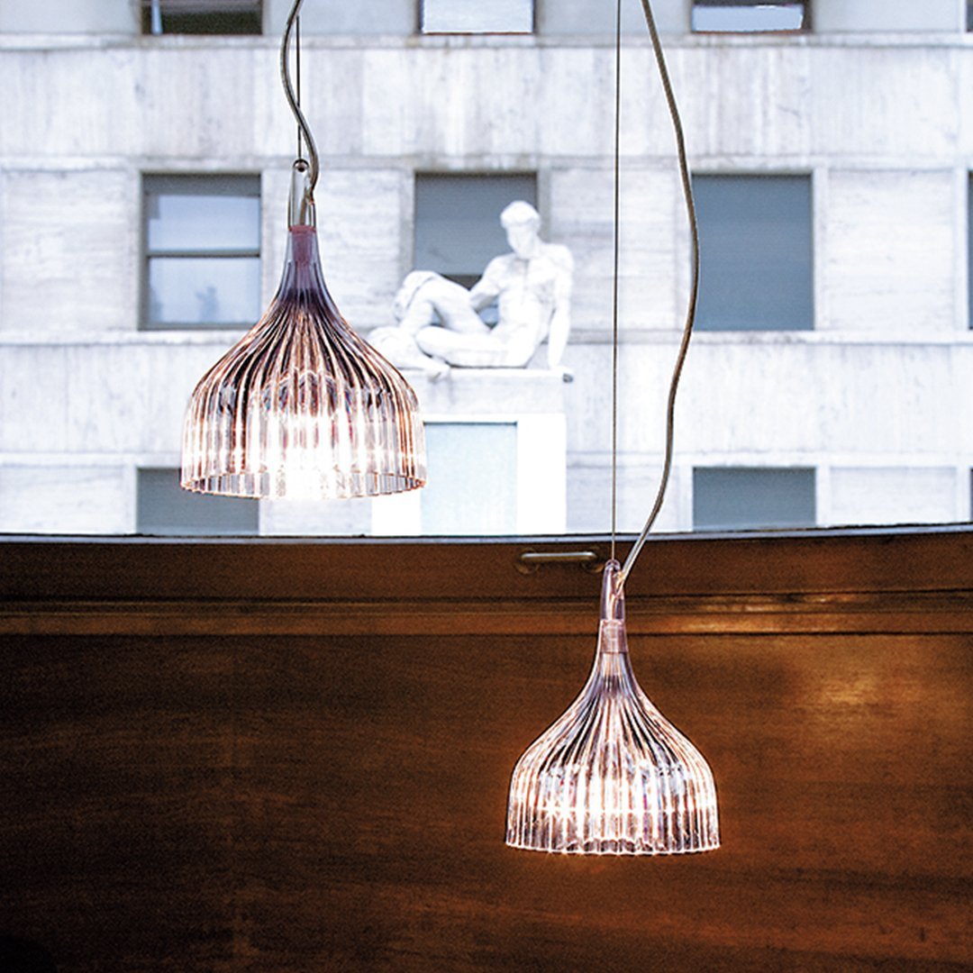 Clear glass pendant lights with delicate striped patterns, adding a modern touch to any space.