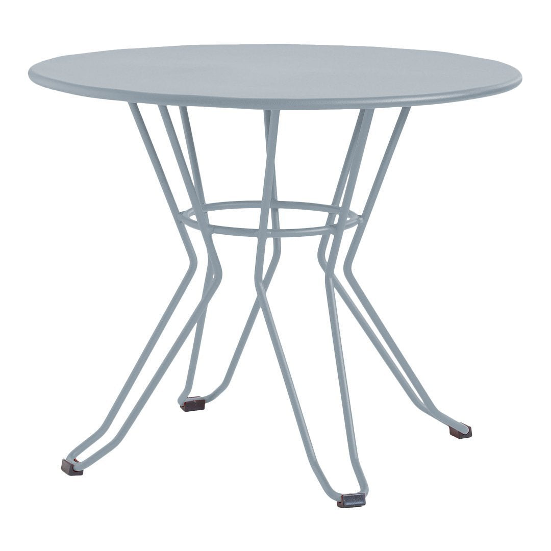 Light blue round table with a sleek open metal base, perfect for modern outdoor or indoor settings. 