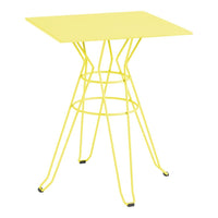 Bright yellow square table with a modern wire base, featuring a sleek, minimalist design. Perfect for vibrant spaces.