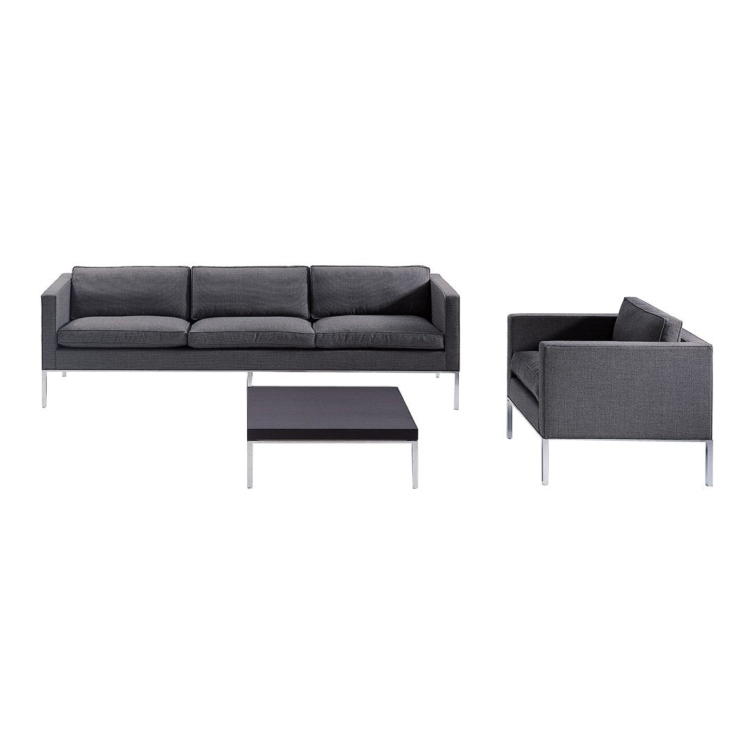 Modern gray sofa set with clean lines and a minimalist design, featuring sleek silver legs and a geometric pattern.