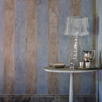 Striped wall design featuring soft blues, grays, and taupes with a subtle texture, enhancing any interior decor.