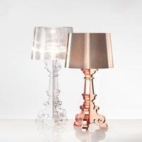 Clear and rose gold modern lamps featuring elegant shapes and pleated shades, perfect for stylish home decor.