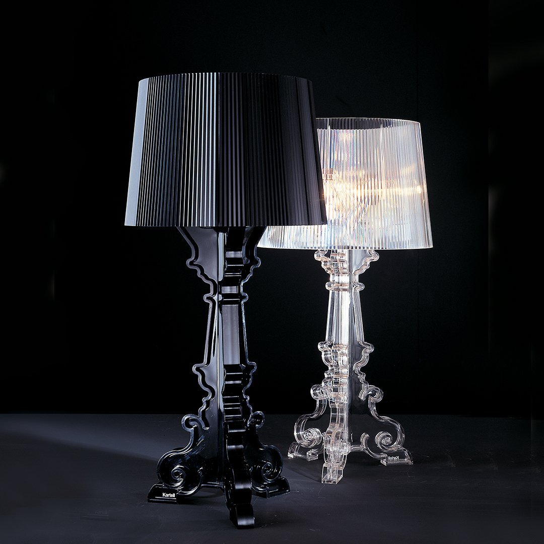 Black and transparent lamps with elegant patterns against a dark background, showcasing modern design.