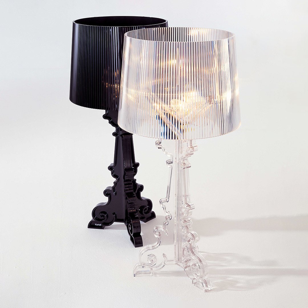 "Two stylish lamps: one in sleek black and the other in clear, featuring elegant ribbed shades."