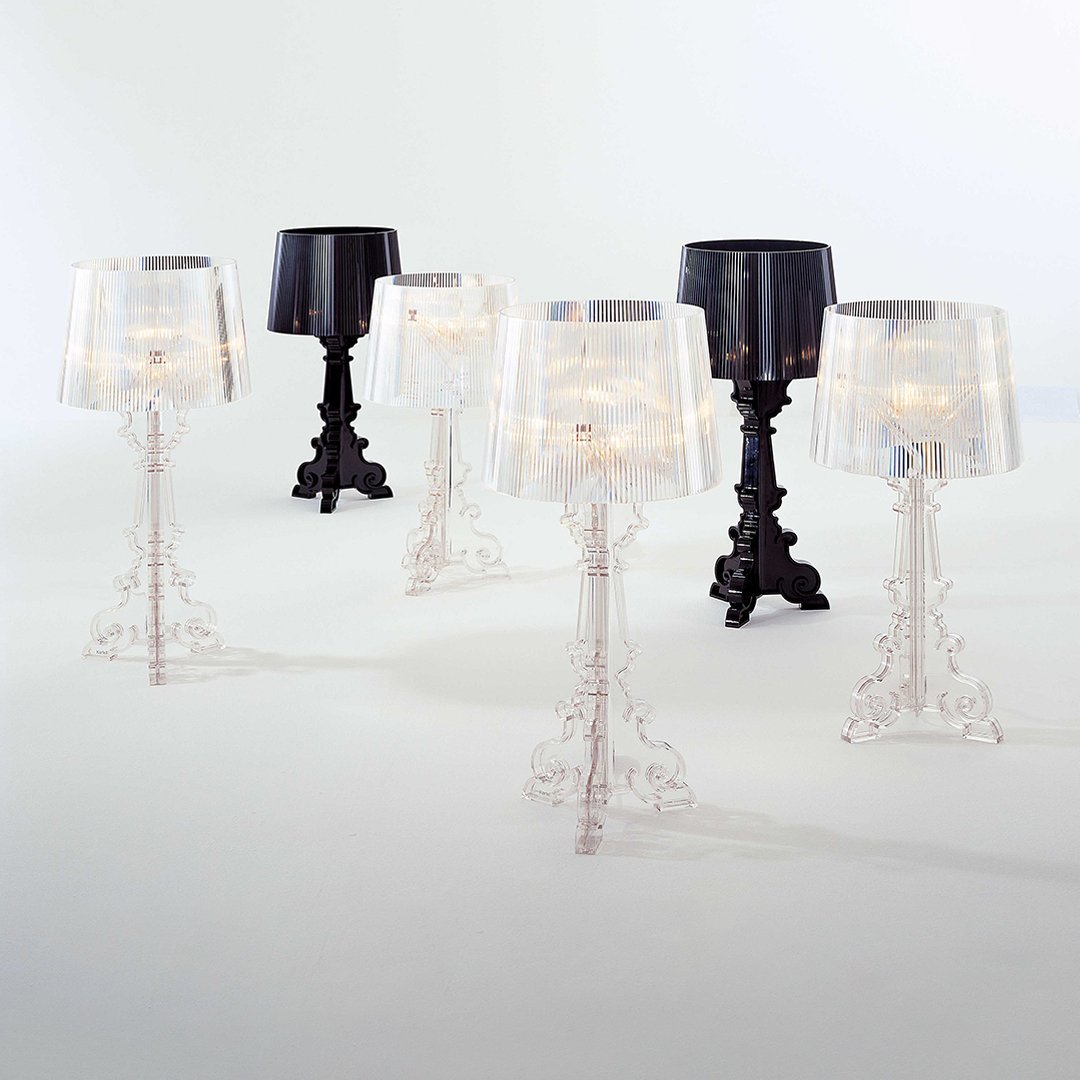 Clear and black decorative lamps featuring intricate bases, elegant shades, and a modern design.