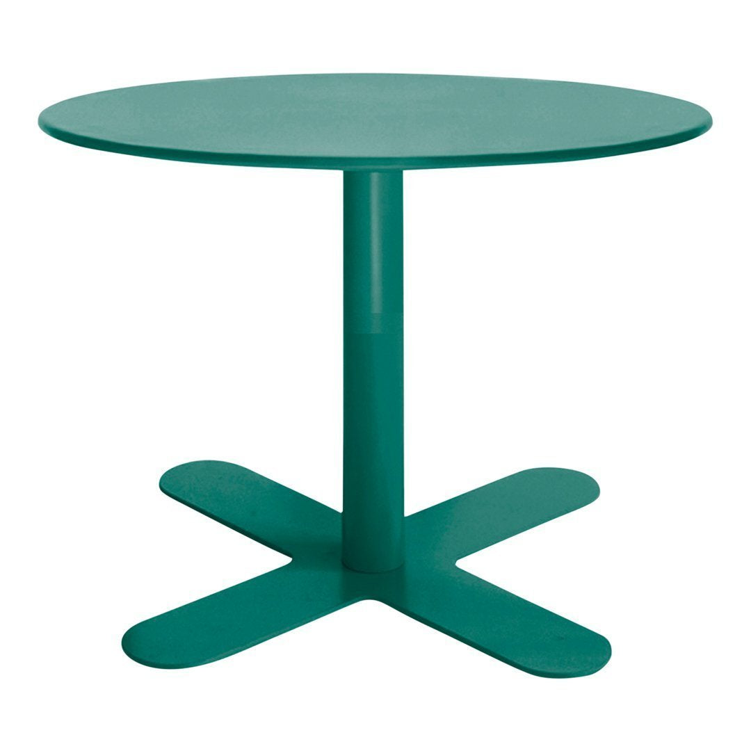 Round teal table with a smooth surface and a stable, four-legged base, perfect for modern decor.