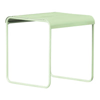 Light green metal side table with a minimalist design and smooth, curved edges. Perfect for modern decor.