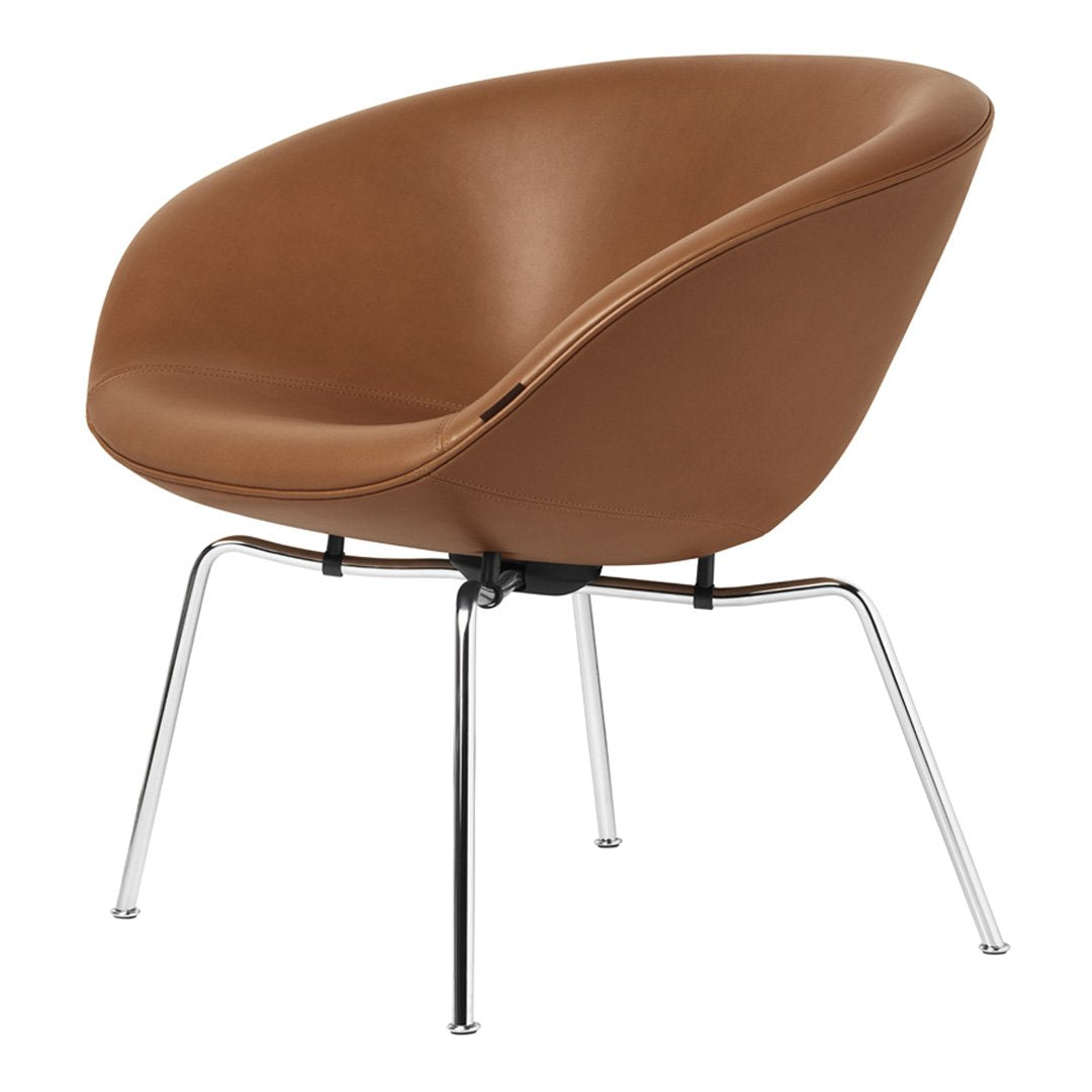 Brown leather chair with rounded design and shiny chrome legs, adding warmth and elegance to any space.