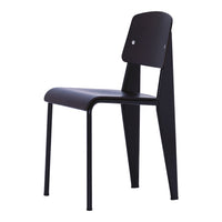 Black minimalist chair with sleek lines and a smooth finish, featuring an angular backrest and simple design elements.