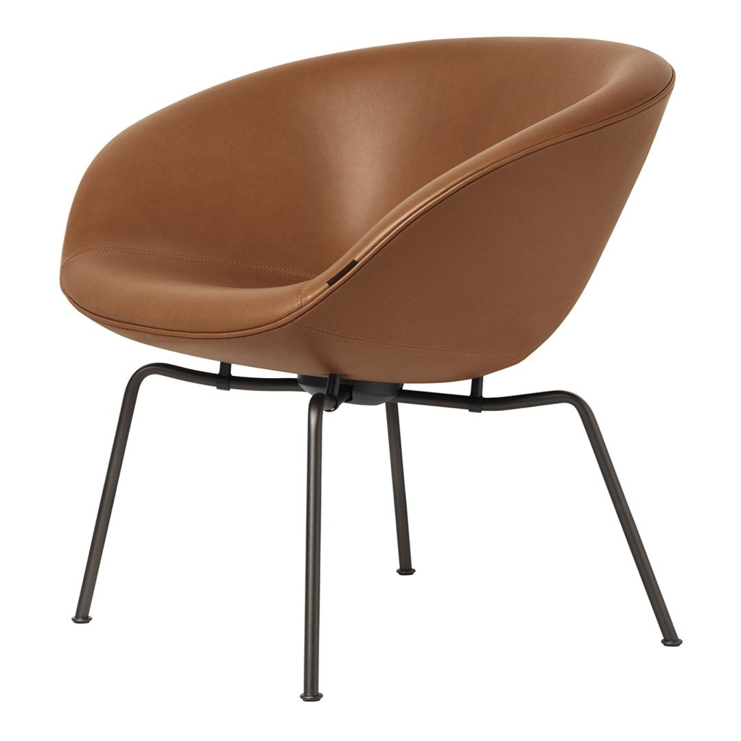 Brown cushioned chair with sleek, curved design and black metal legs. Perfect for modern decor.