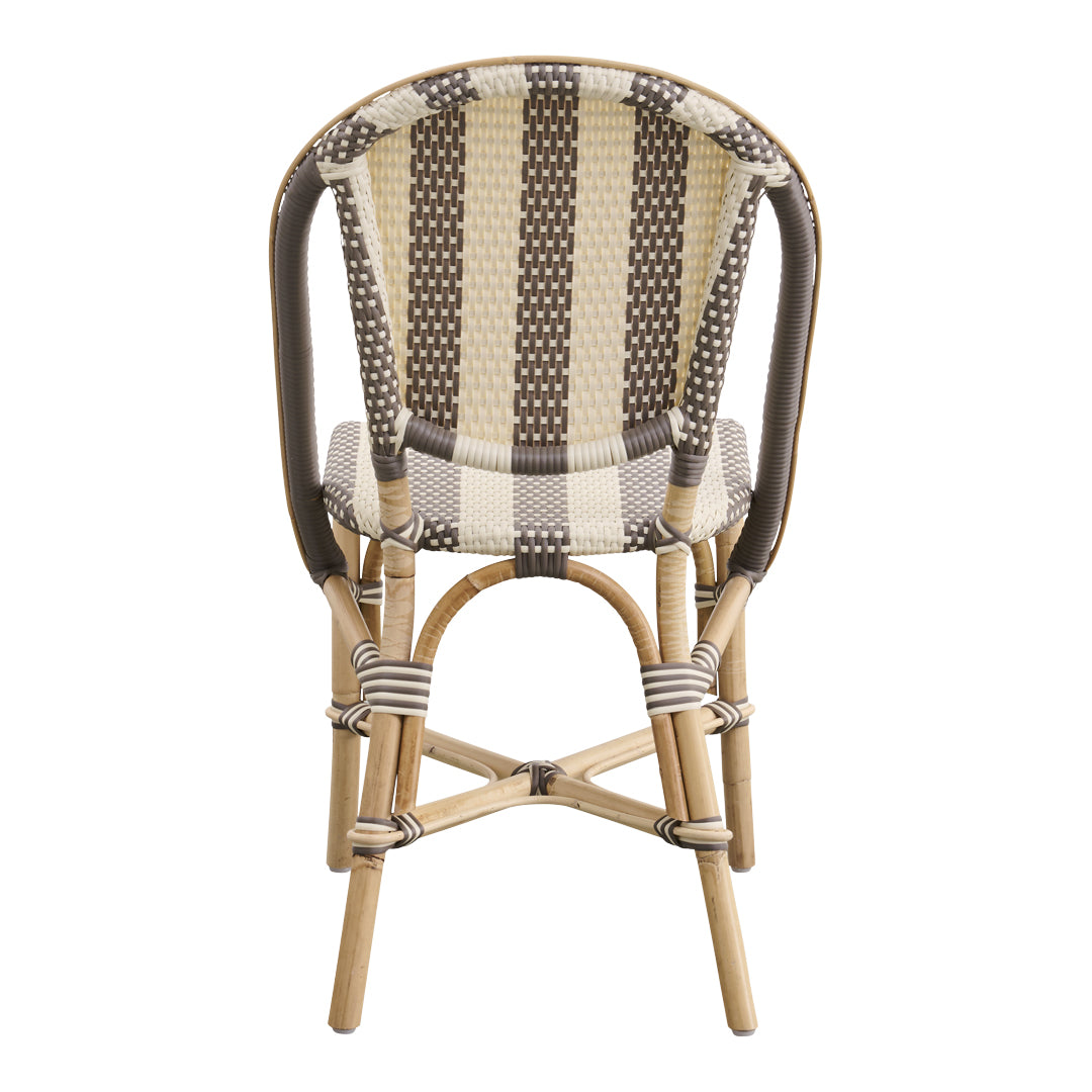 Brown and cream patterned chair with woven texture and natural rattan legs, perfect for stylish decor.