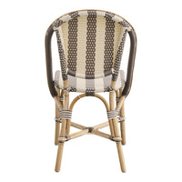Brown and cream patterned chair with woven texture and natural rattan legs, perfect for stylish decor.