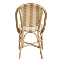 Back view of a rattan chair featuring a cream and beige striped pattern with natural bamboo accents.