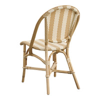 Beige and cream striped pattern on a woven chair, with natural bamboo frame for a chic design.