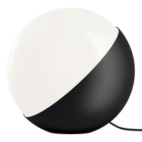 Black and white modern lamp with a half-sphere design, featuring a matte black base and a glossy white top.