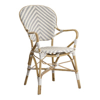 Woven rattan chair featuring a chic white and grey zigzag pattern with natural wood accents.