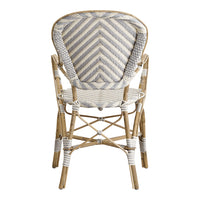 White and beige patterned chair with a chevron design, featuring natural bamboo accents for a stylish look.