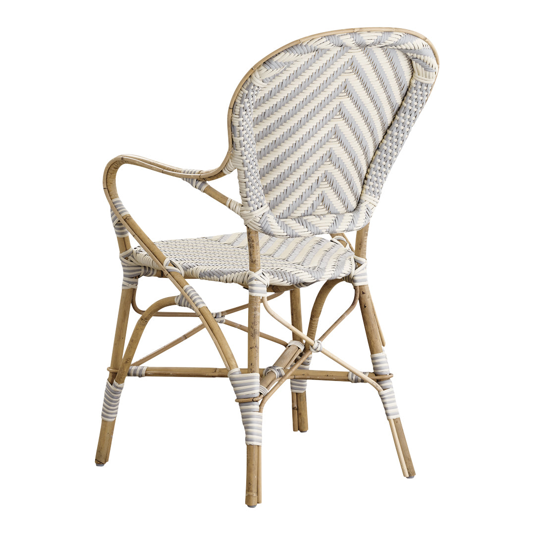 White and beige woven cane chair featuring a herringbone pattern, elegant and stylish for any decor.