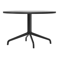 Round black table with a sleek, modern design and a minimalist black base. Perfect for contemporary decor.