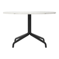 Round white marble table with a sleek black metal base, featuring a minimalist design and smooth finish.