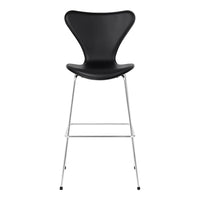 Black curved seat barstool with a sleek metal frame, featuring a minimalist design and elegant silhouette.