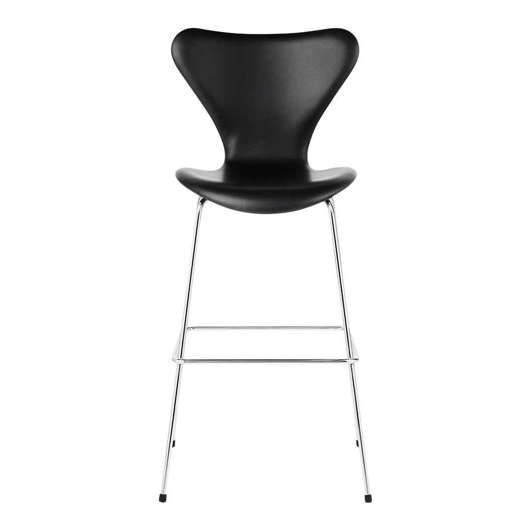 Black modern bar stool with a sleek, curved design and chrome legs. Ideal for contemporary spaces.
