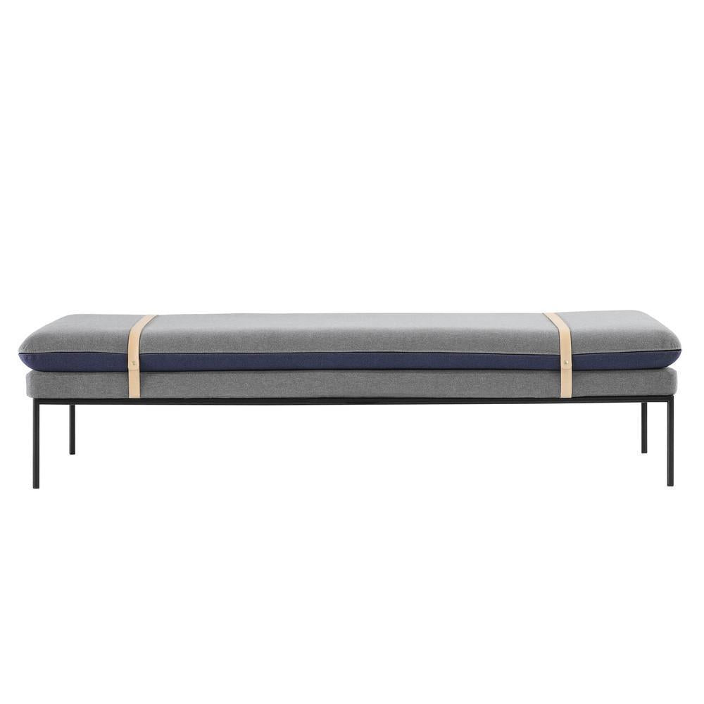 Gray and navy patterned cushion on a sleek black metal frame, enhanced with stylish beige straps.
