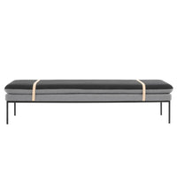 Sleek black and grey two-tone bench with minimalist design and natural wood accent strap.