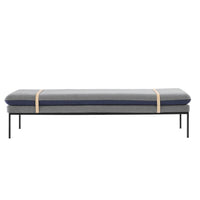 Gray and navy upholstered bench with a minimalist black metal frame and natural wood accents. Modern design.