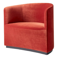 Vibrant red velvet accent chair with a smooth, curved design and a sleek black base for a modern touch.