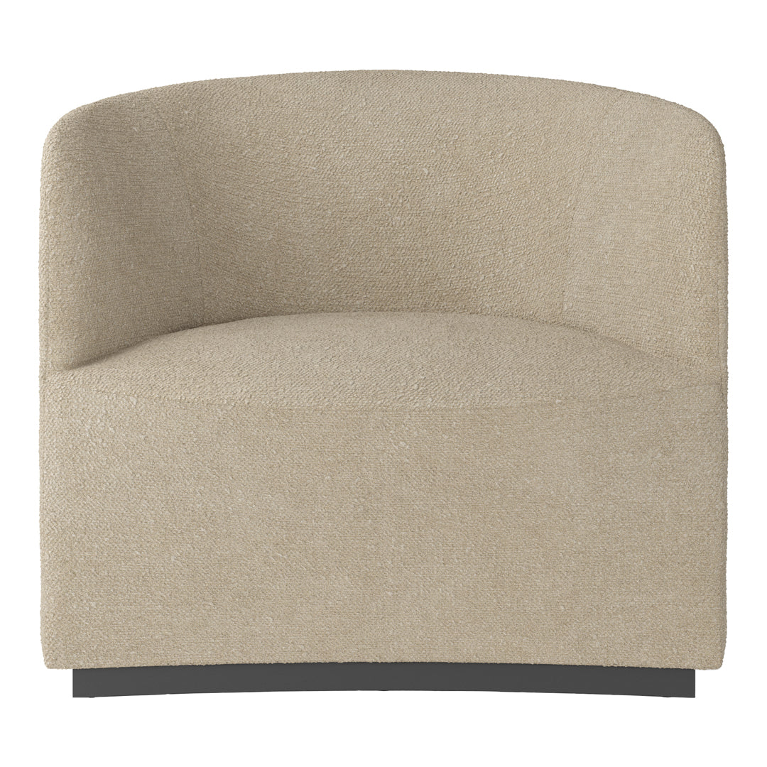 Beige textured armchair with a soft, inviting surface and curved design, perfect for cozy interiors.