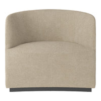 Beige textured armchair with a soft, inviting surface and curved design, perfect for cozy interiors.