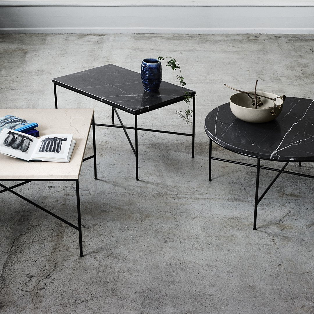 "Three modern coffee tables featuring black and beige marble patterns and sleek black metal legs."