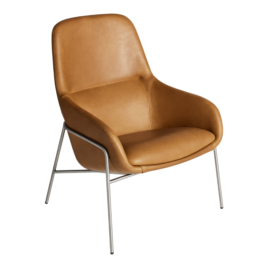 Tan leather chair with smooth, curved design and sleek stainless steel legs. Perfect for modern decor.