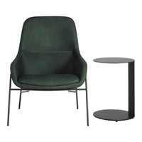 Green upholstered chair with smooth, rounded edges and a sleek black side table featuring a minimalist design.
