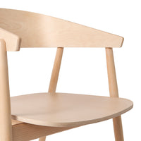 Light natural wood chair with smooth grain and simple design, featuring a pale beige finish and minimalist patterns.