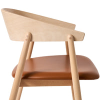Light natural wood chair with a sleek light tan leather seat, featuring smooth curves and clean lines.