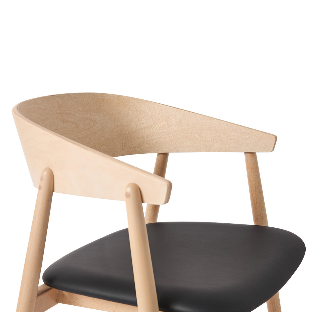 Light wood frame with a smooth, natural finish and a sleek black faux leather seat. Modern, minimalist design.