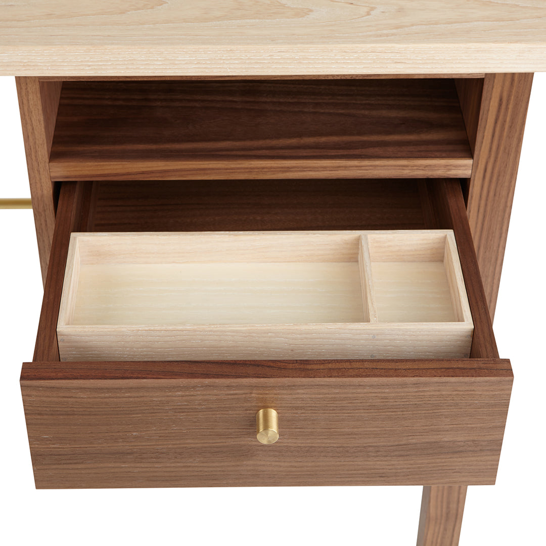 Wooden dresser with a light maple top, rich walnut drawers, and a sleek brass knob detail.
