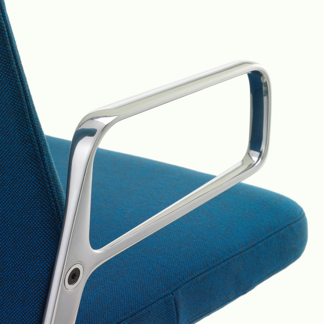 Vibrant blue fabric with a sleek silver armrest, showcasing a modern and minimalist design.