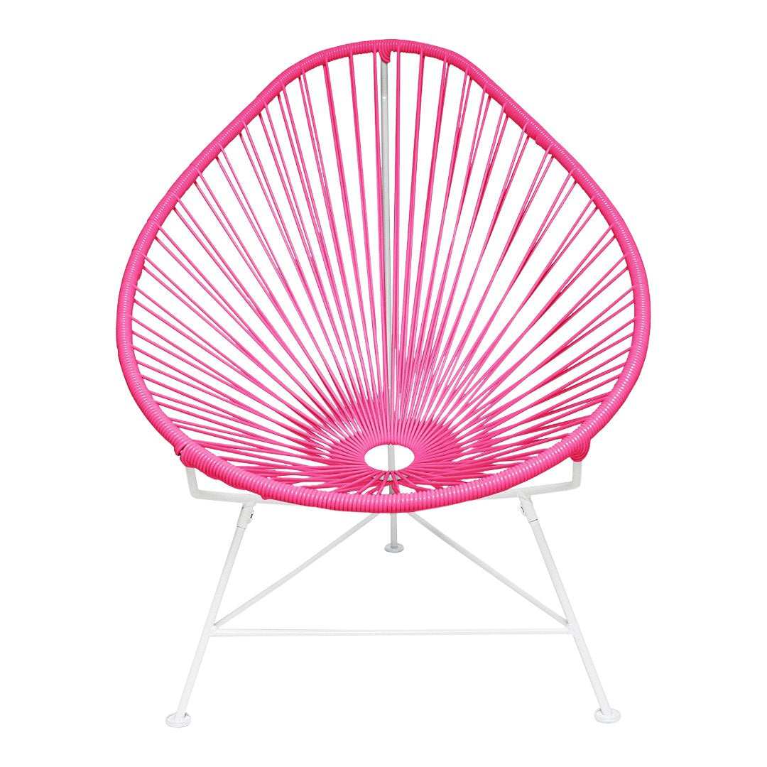 Bright pink Acapulco chair with a unique radial pattern and white metal legs. Ideal for vibrant outdoor decor.