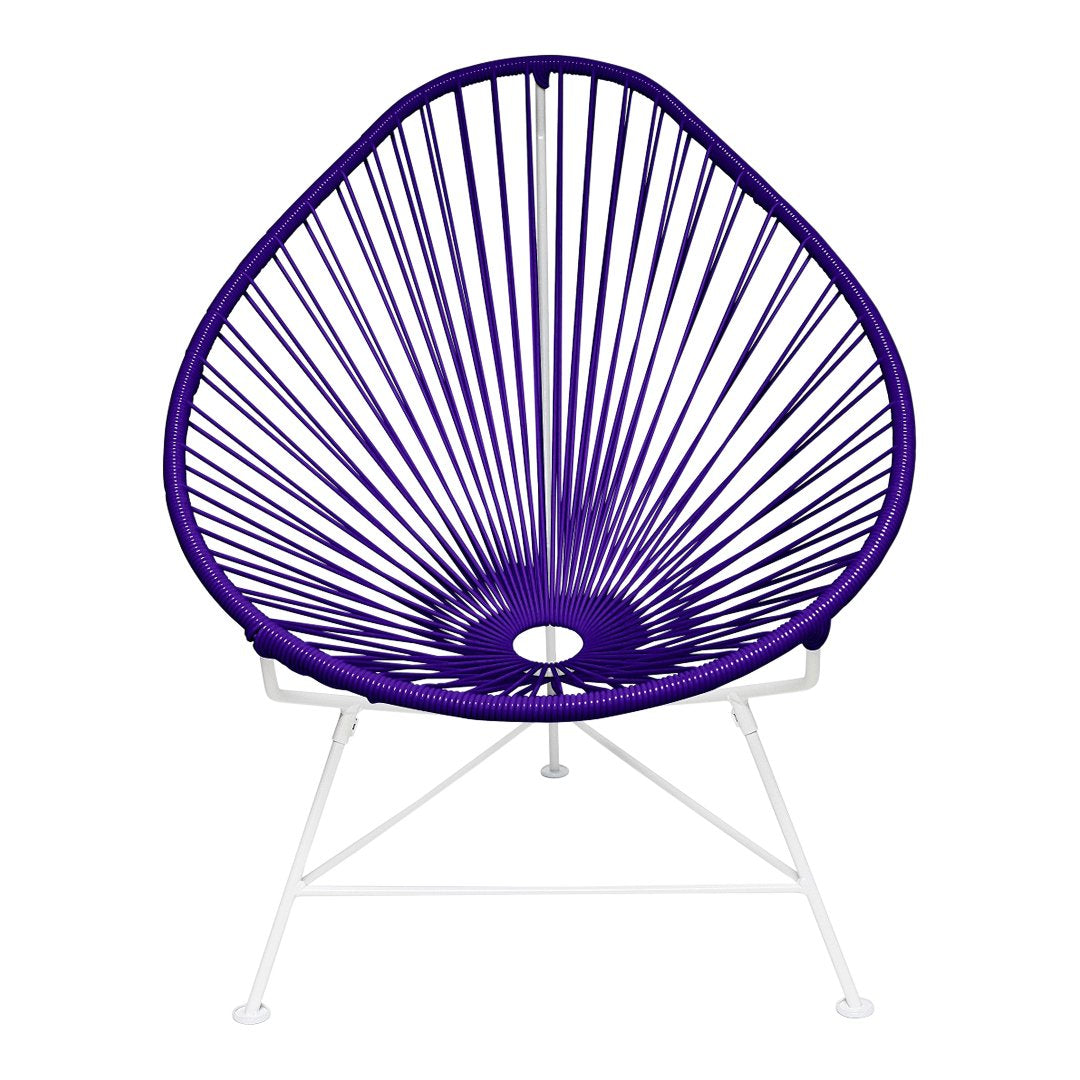 Purple Acapulco chair with a geometric pattern and white metal legs, perfect for modern decor.