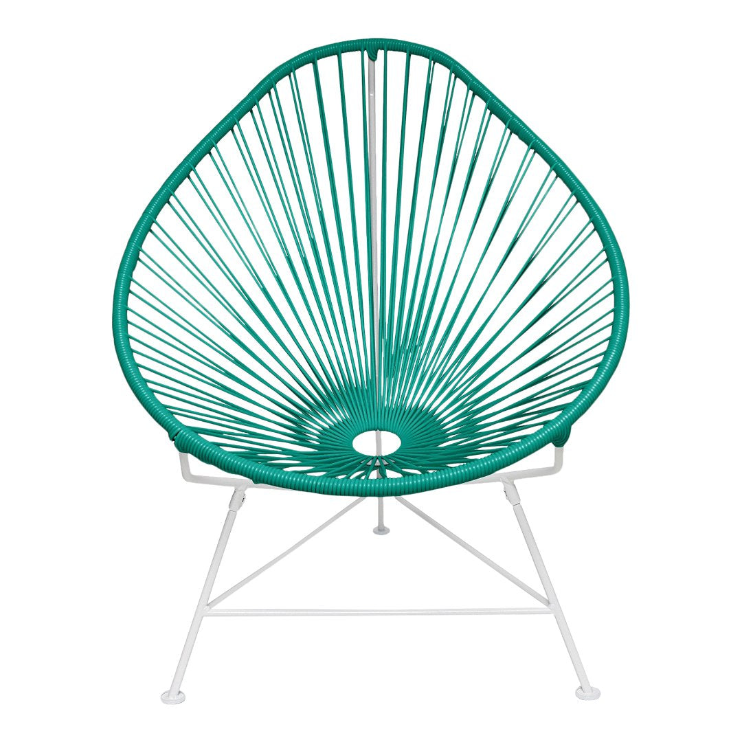 Teal Acapulco chair with a geometric radial pattern, featuring white metal legs, perfect for modern outdoor decor.