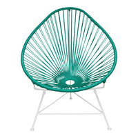 Teal Acapulco chair with a geometric radial pattern, featuring white metal legs, perfect for modern outdoor decor.