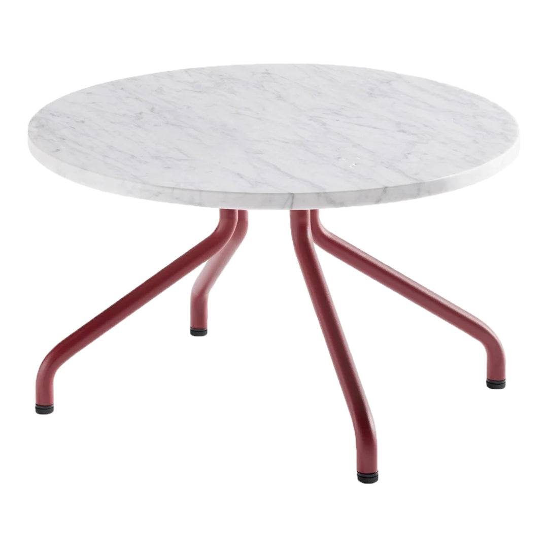 Round coffee table with a white marble top and a red metal base. Sleek and modern design featuring contrasting colors.